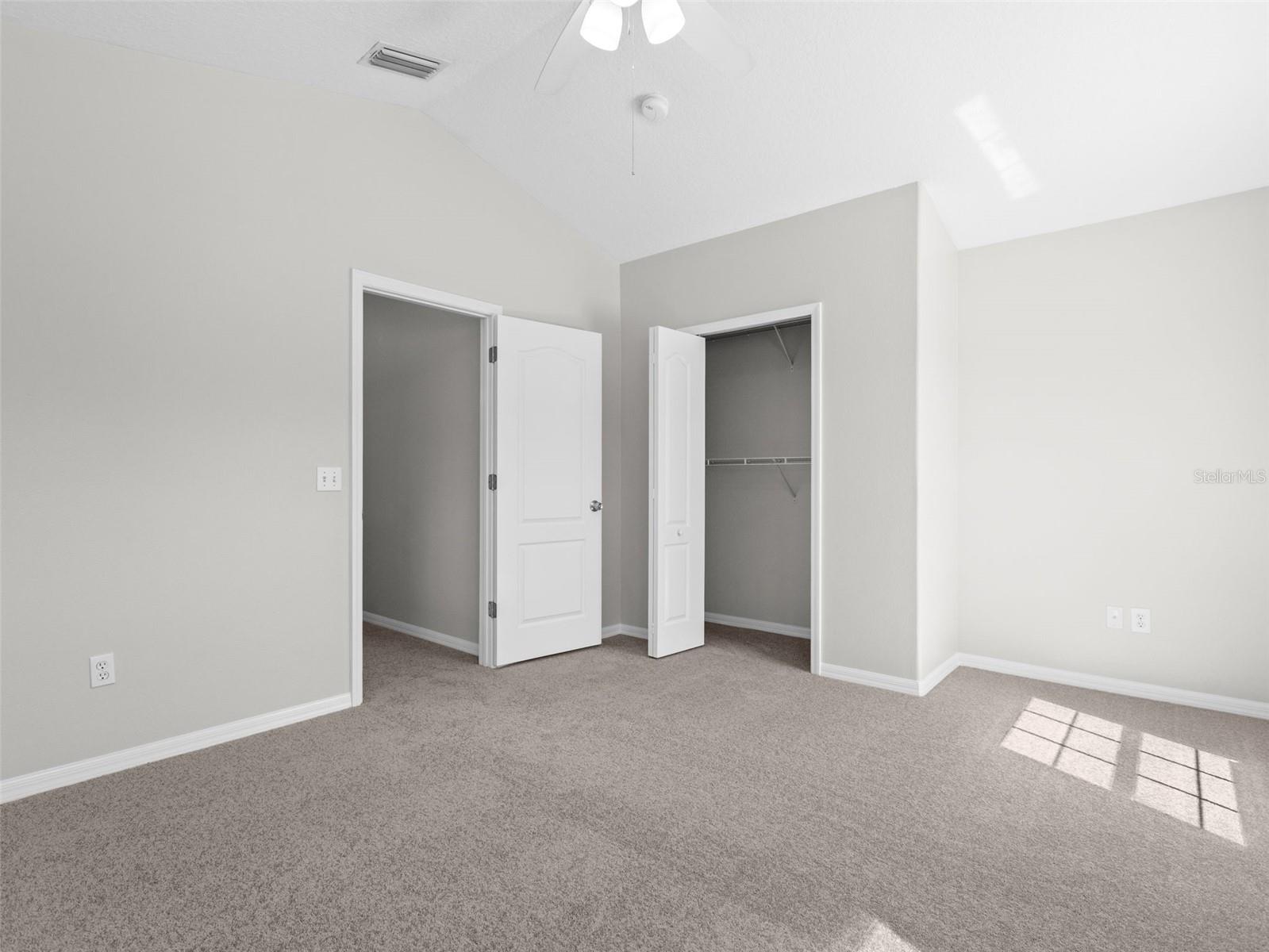 Upstairs bedroom with vaulted ceiling