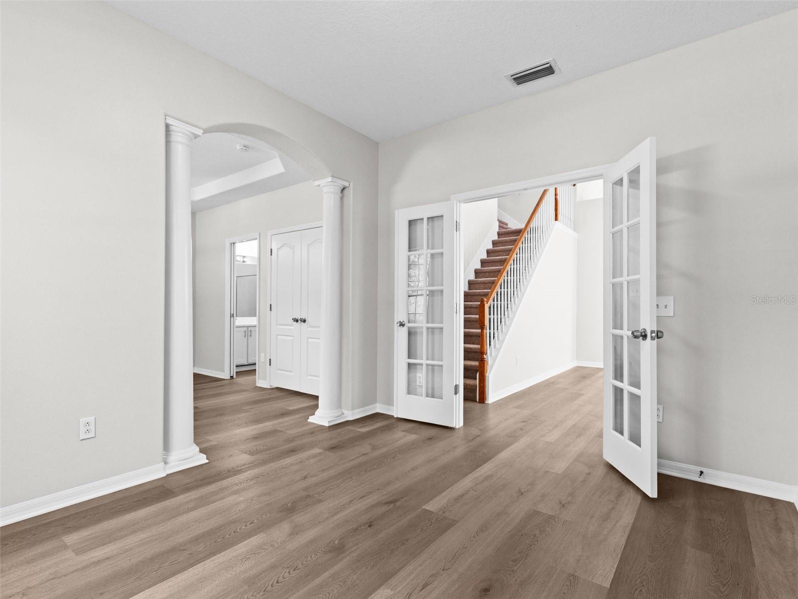 Primary bedroom en suite with den and double door entry