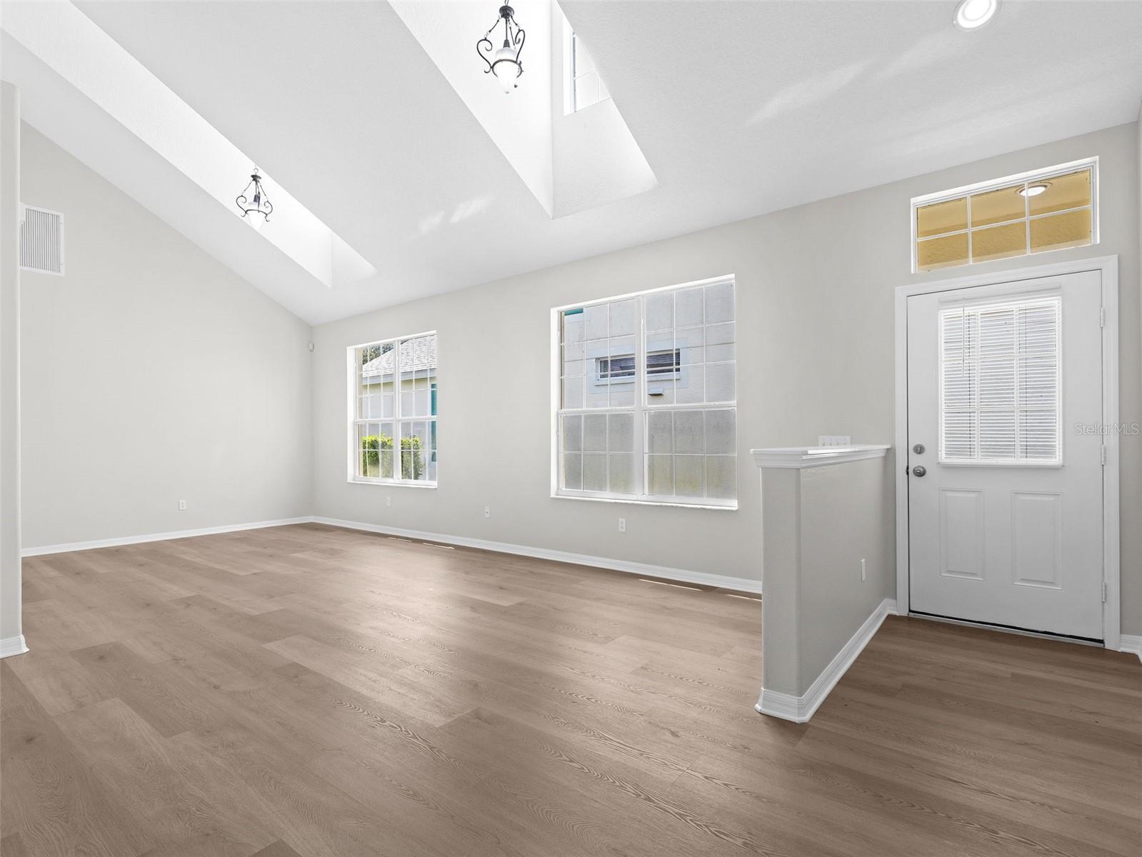 Living room and Dining room with skylights