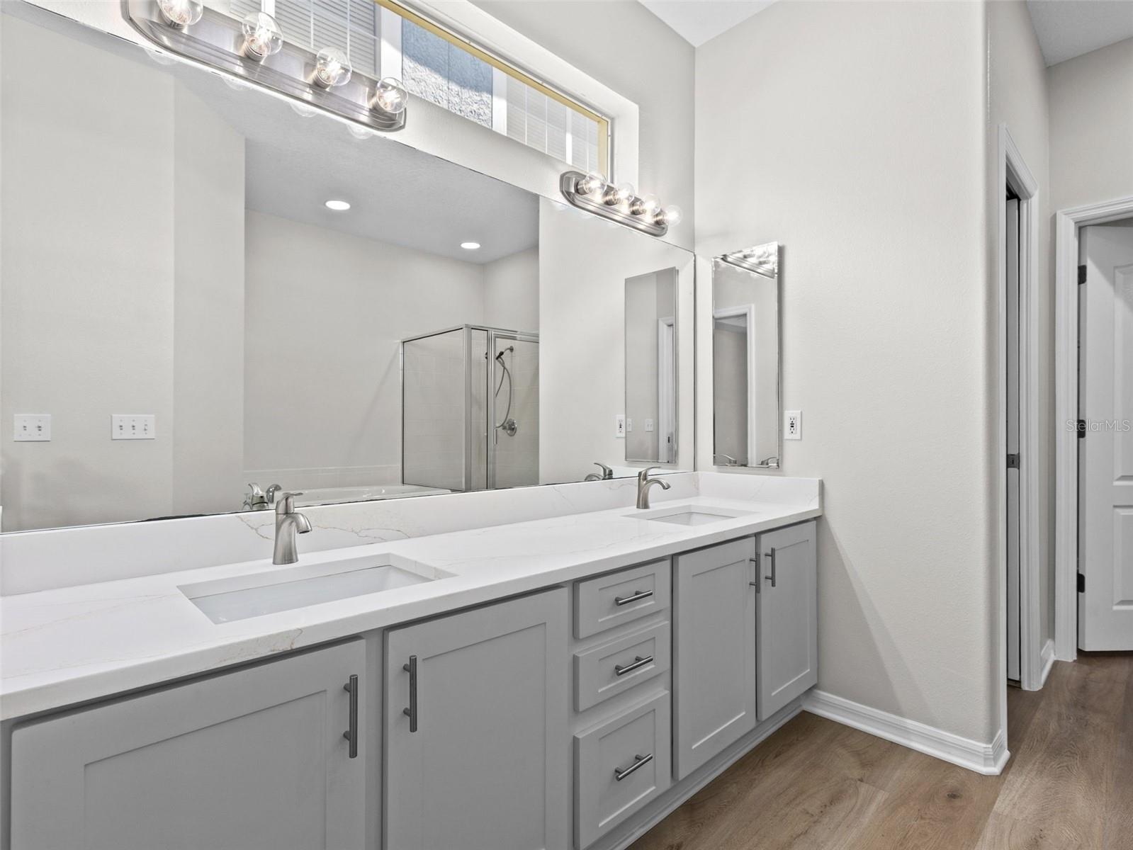 Primary bathroom with double vanity sinks