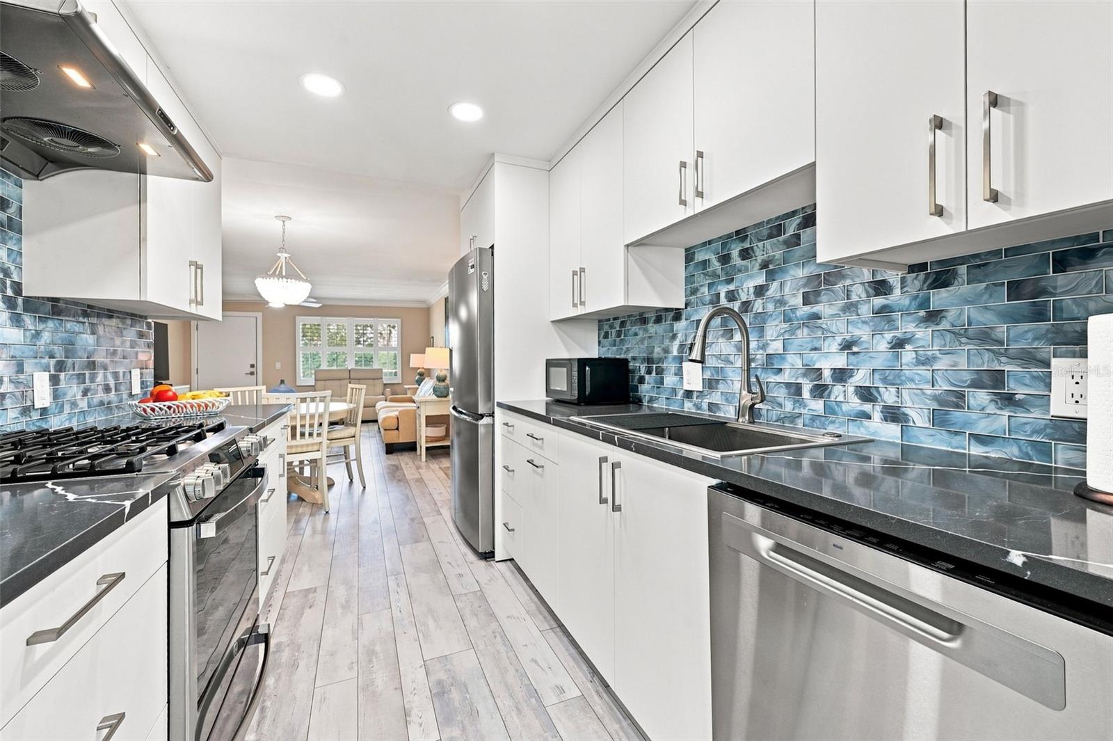 Beautifully upgraded kitchen with custom cabinets, and a GAS stove! Beautifully upgraded kitchen with custom cabinets, and a GAS stove!