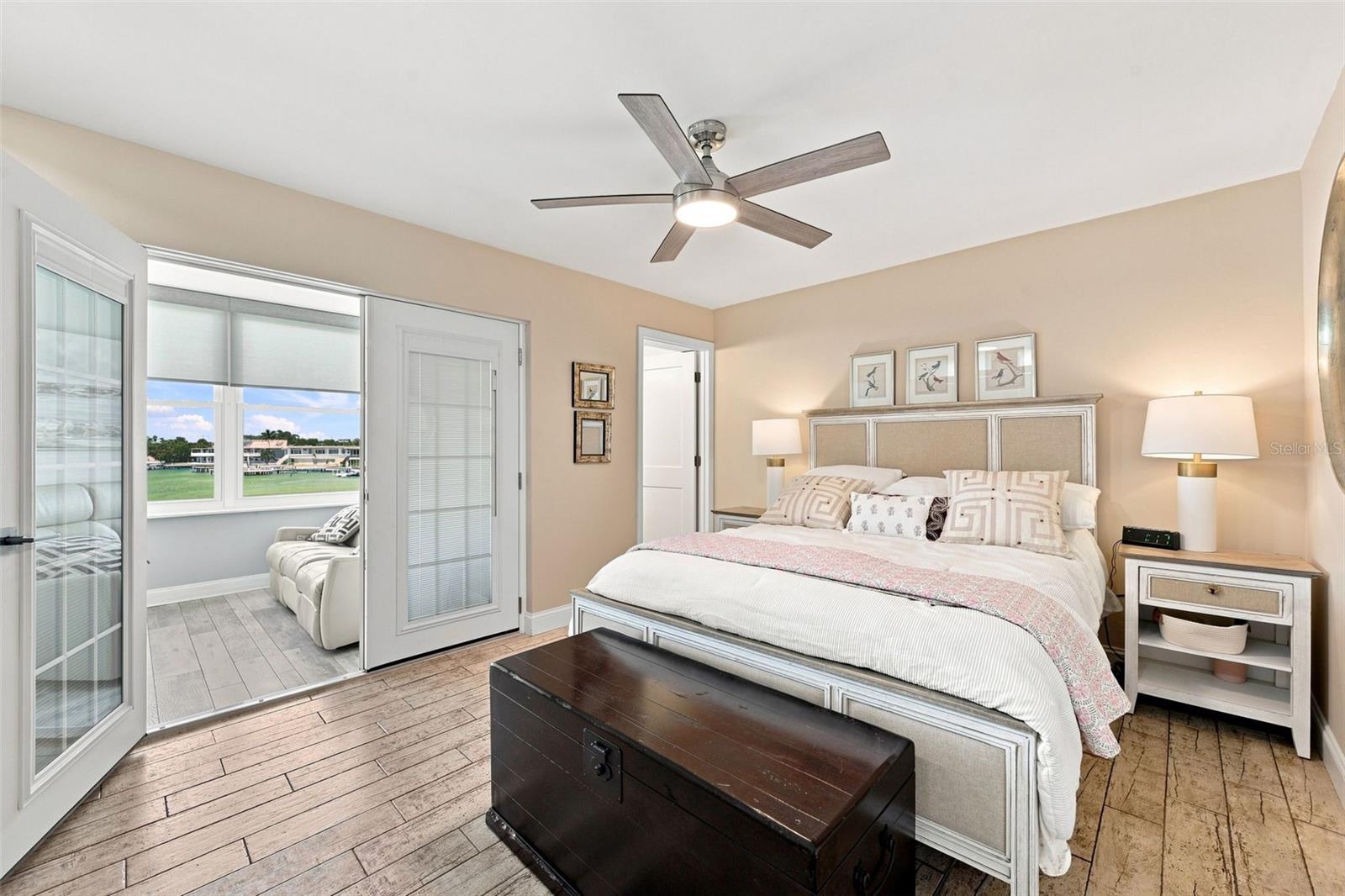 Primary suite has French doors opening to that amazing view!