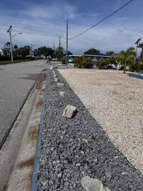 Palms removed on Garage Side to improve traffic visibility