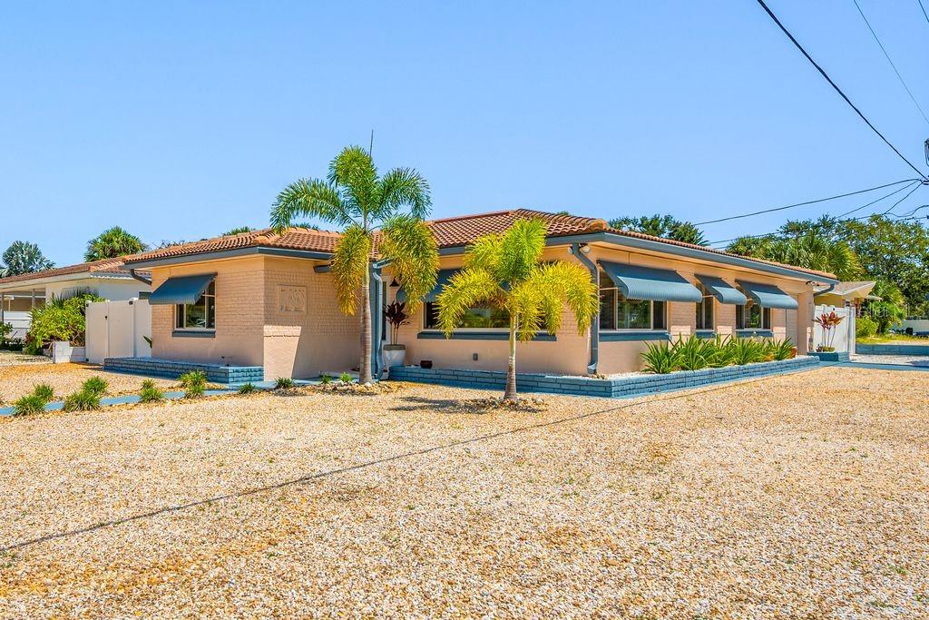 Front Door Entrance is located on Durling Dr. and the Side Facing Garage is located on Pasadena Shores Dr. S.