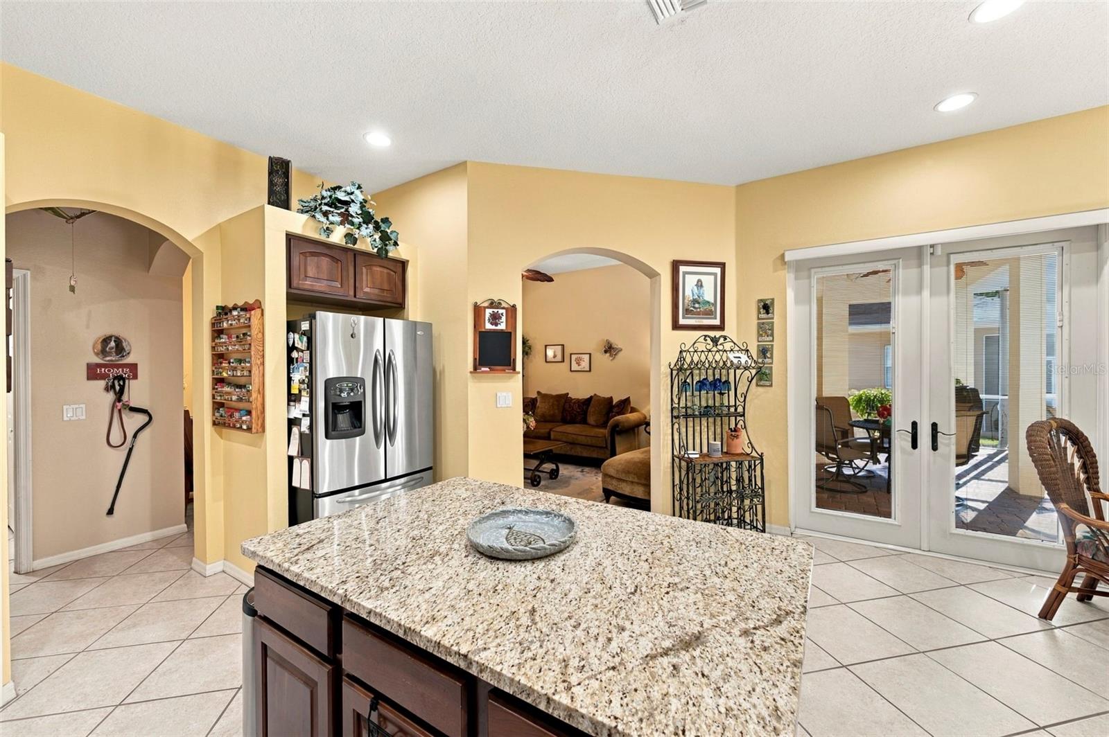 Open concept kitchen - stainless appliances with island