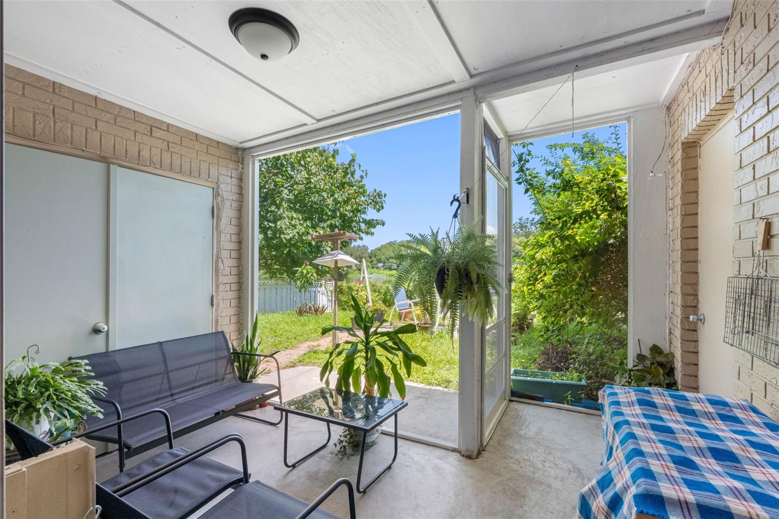Screened Patio with Laundry Closet & Storage.