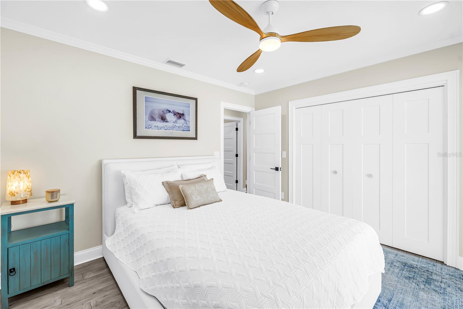 Second bedroom with custom closet built-ins.