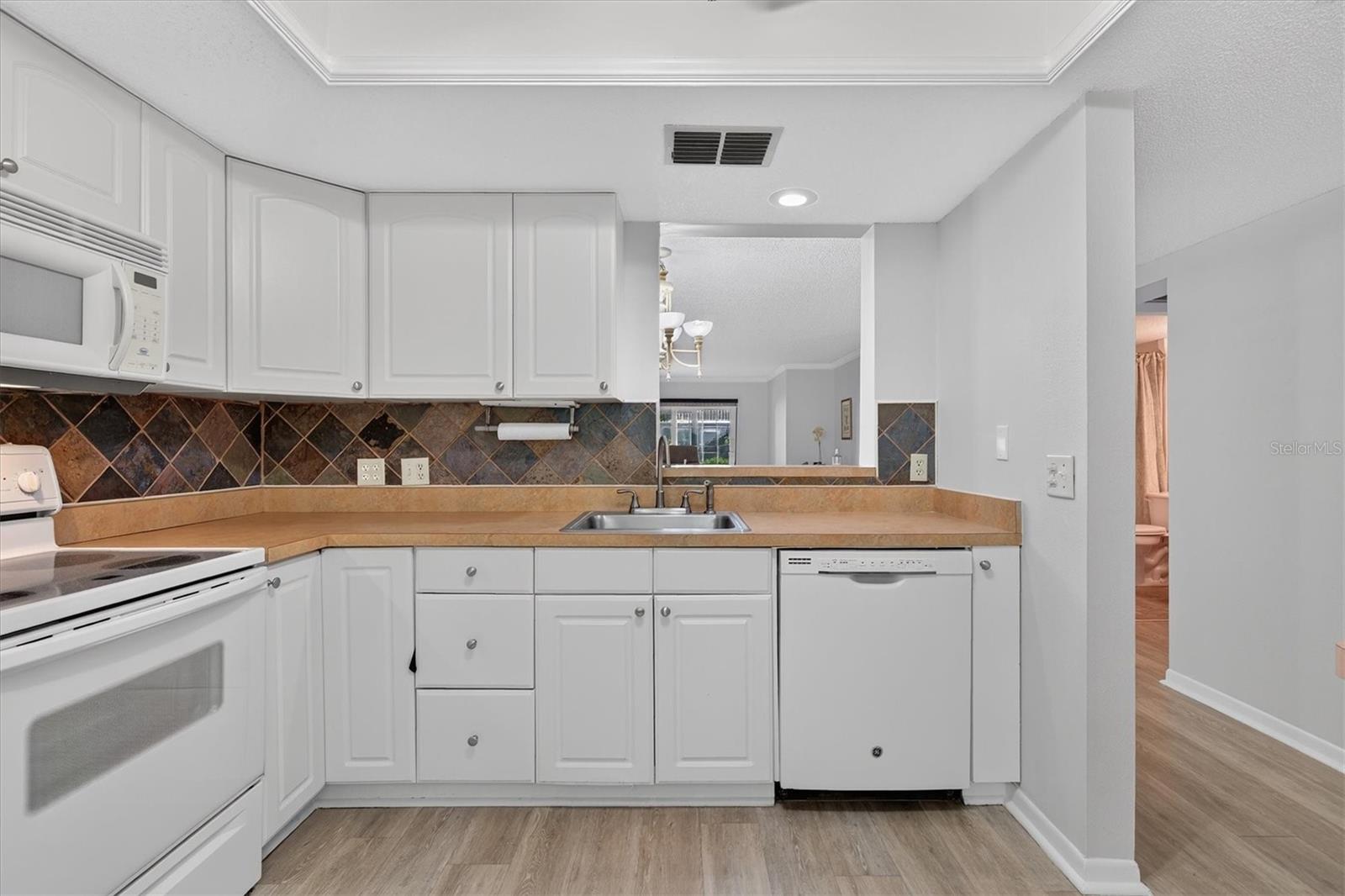 Kitchen opens to living area Kitchen opens to living area