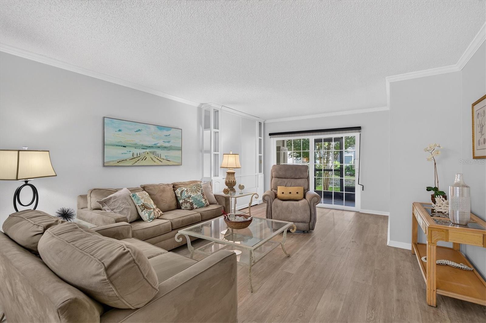 Fresh paint, crown molding and wood look flooring