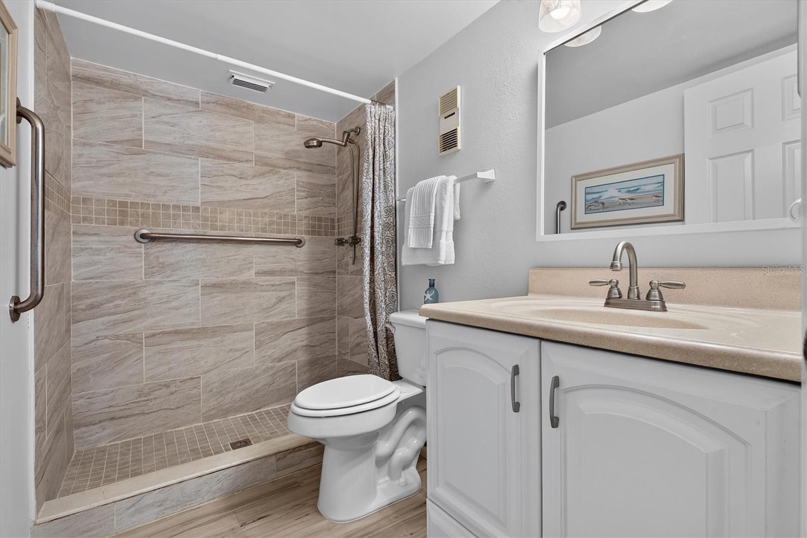 Updated primary bath with tile shower.
