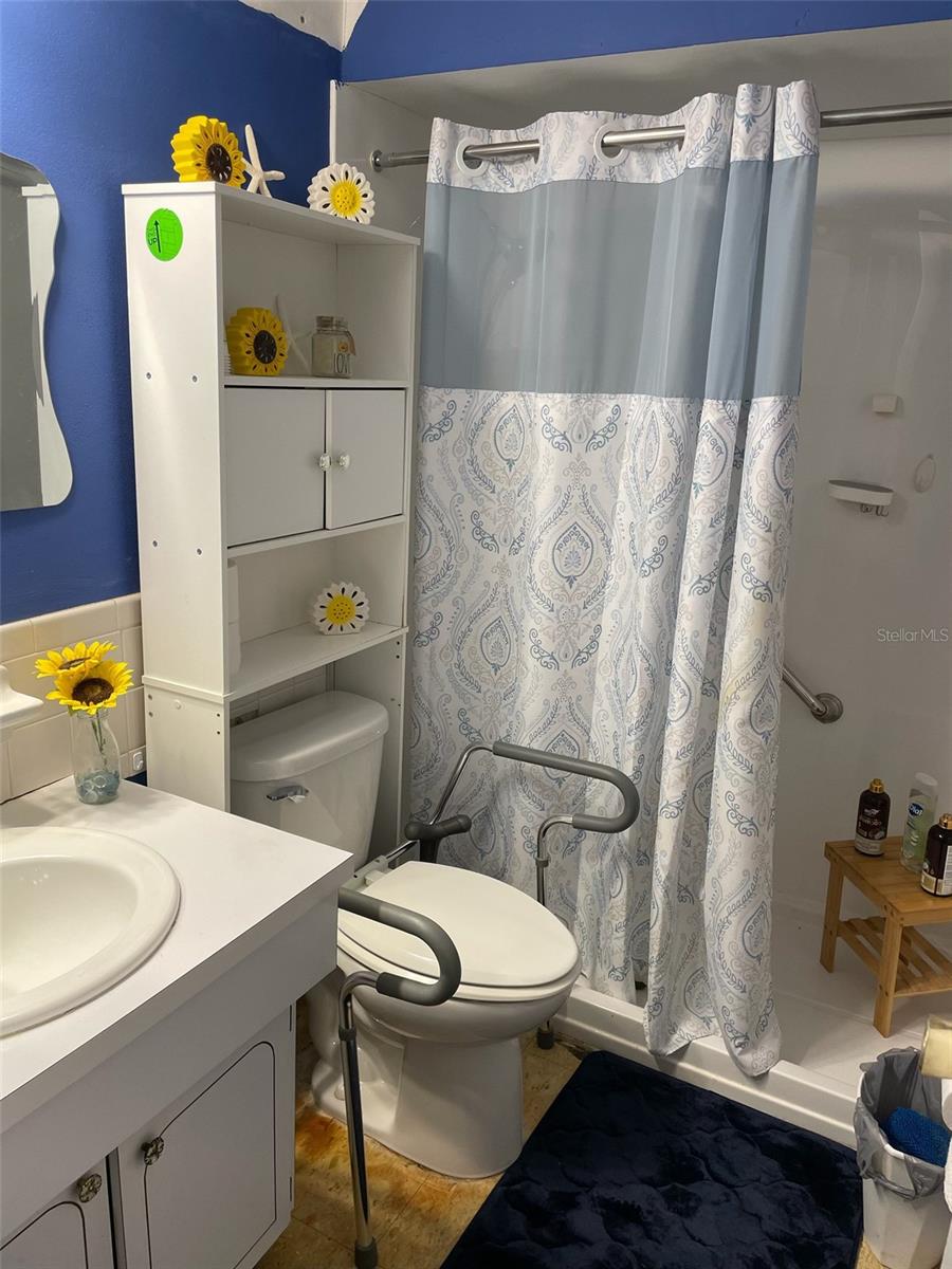 Handicap ready bathroom with walk-in shower.