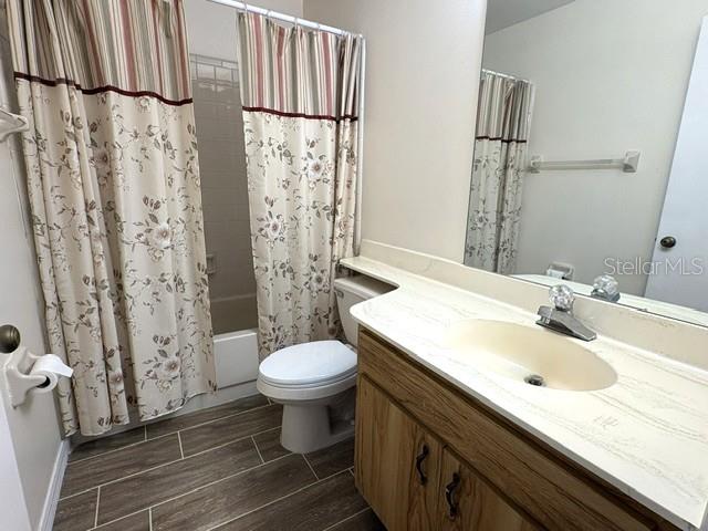 Guest bathroom with tub shower combo.  Updated ceramic tile flooring.