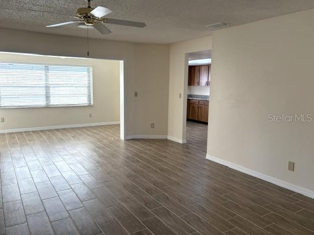 A welcoming living area, updated ceramic tile flooring throughout.  Beautiful natural light from the enclosed lanai.