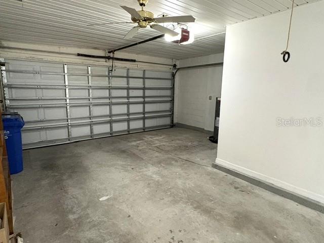 Garage with room for one car and a golf cart.