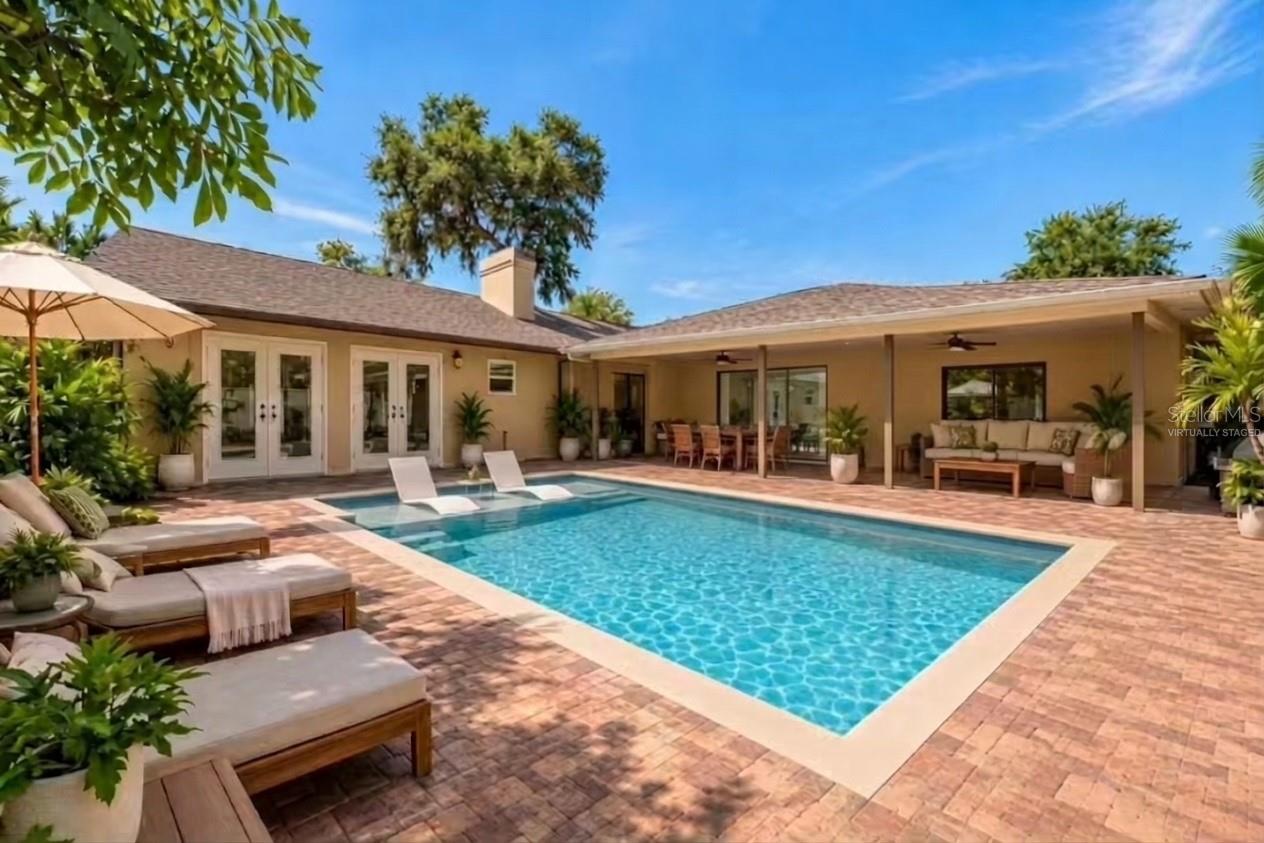 Virtually staged concept for backyard pool addition.