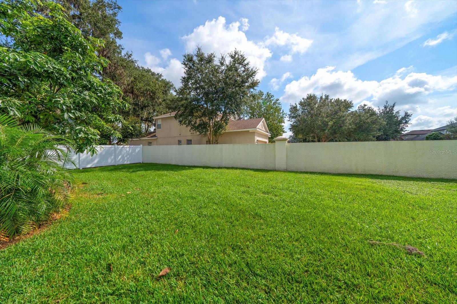 Beautiful oversized lot with programmable  irrigation system.