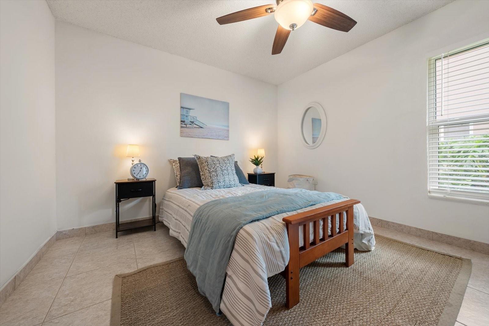 This sweet room is bright and located around the corner from the kitchen making it a wonderful playroom or children's bedroom or second office.
