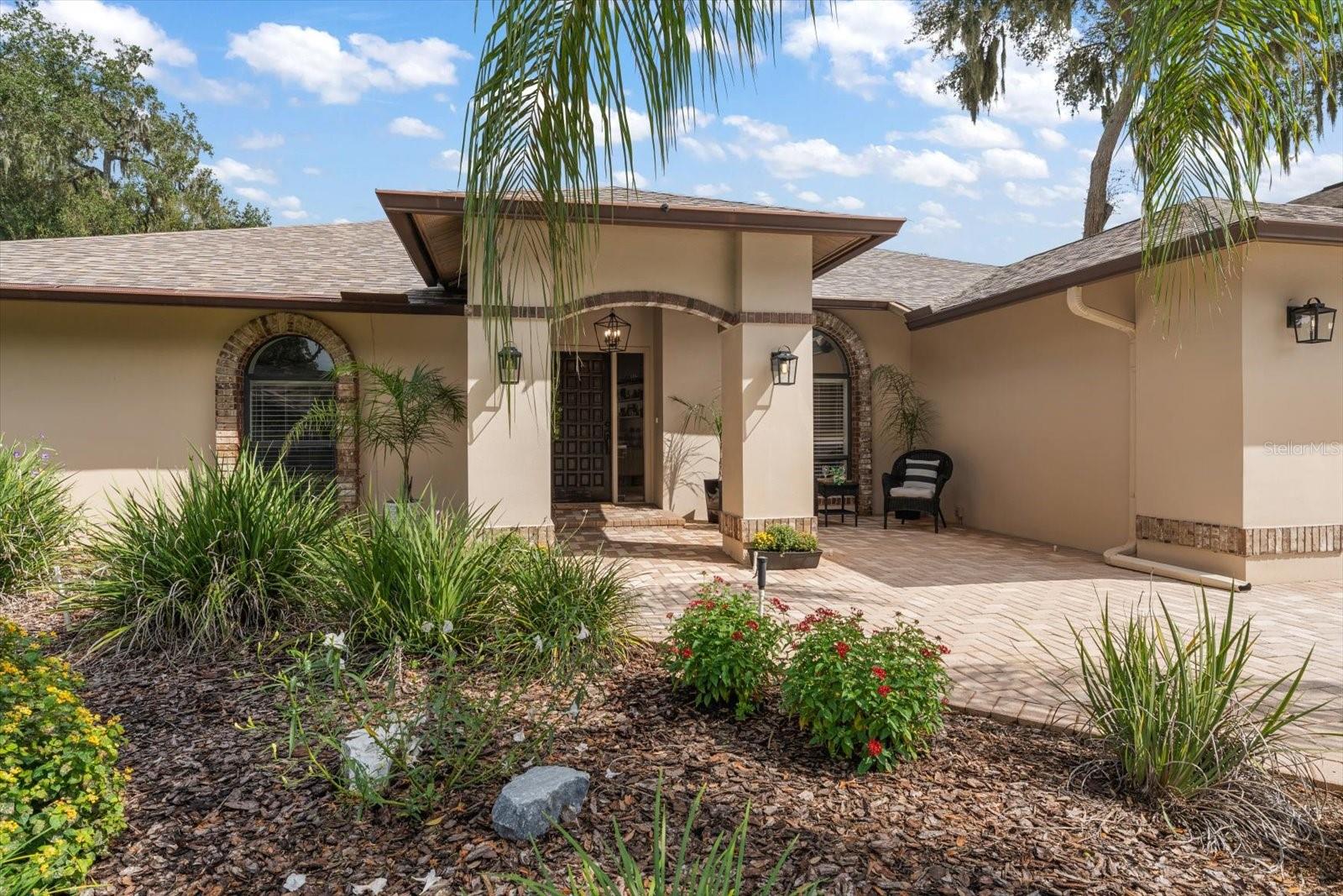 Paved front courtyard for sunsets and connecting with neighbors.