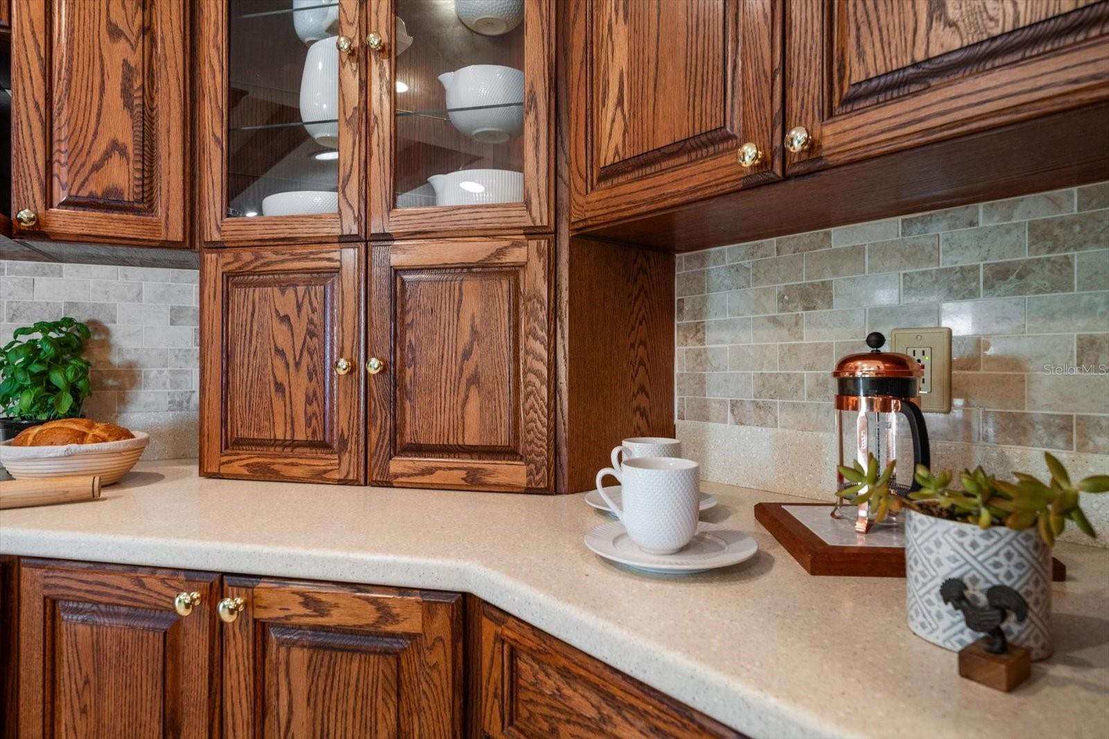Custom hardwood cabinets with pull-out shelves, appliance garge and room for a coffee bar!