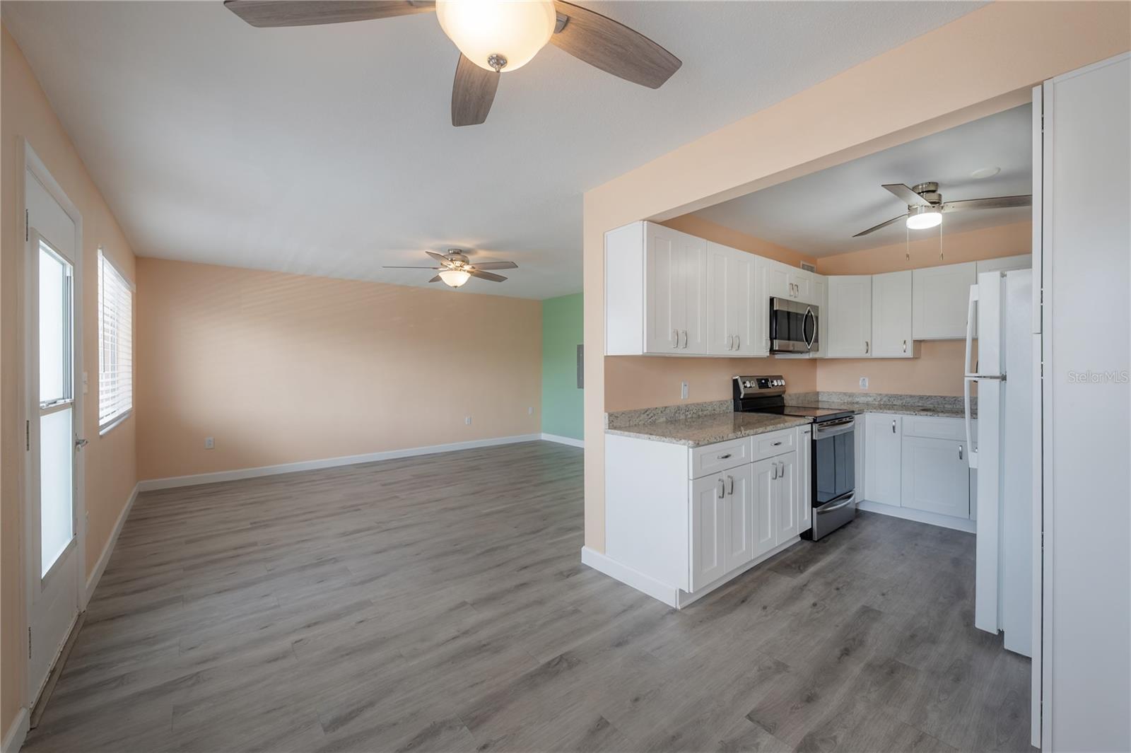 Dining area facing living area and kitchen