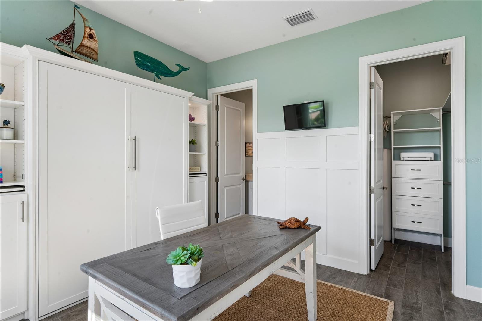 Bedroom 2- built-in Murphy bed with custom shelving and storage