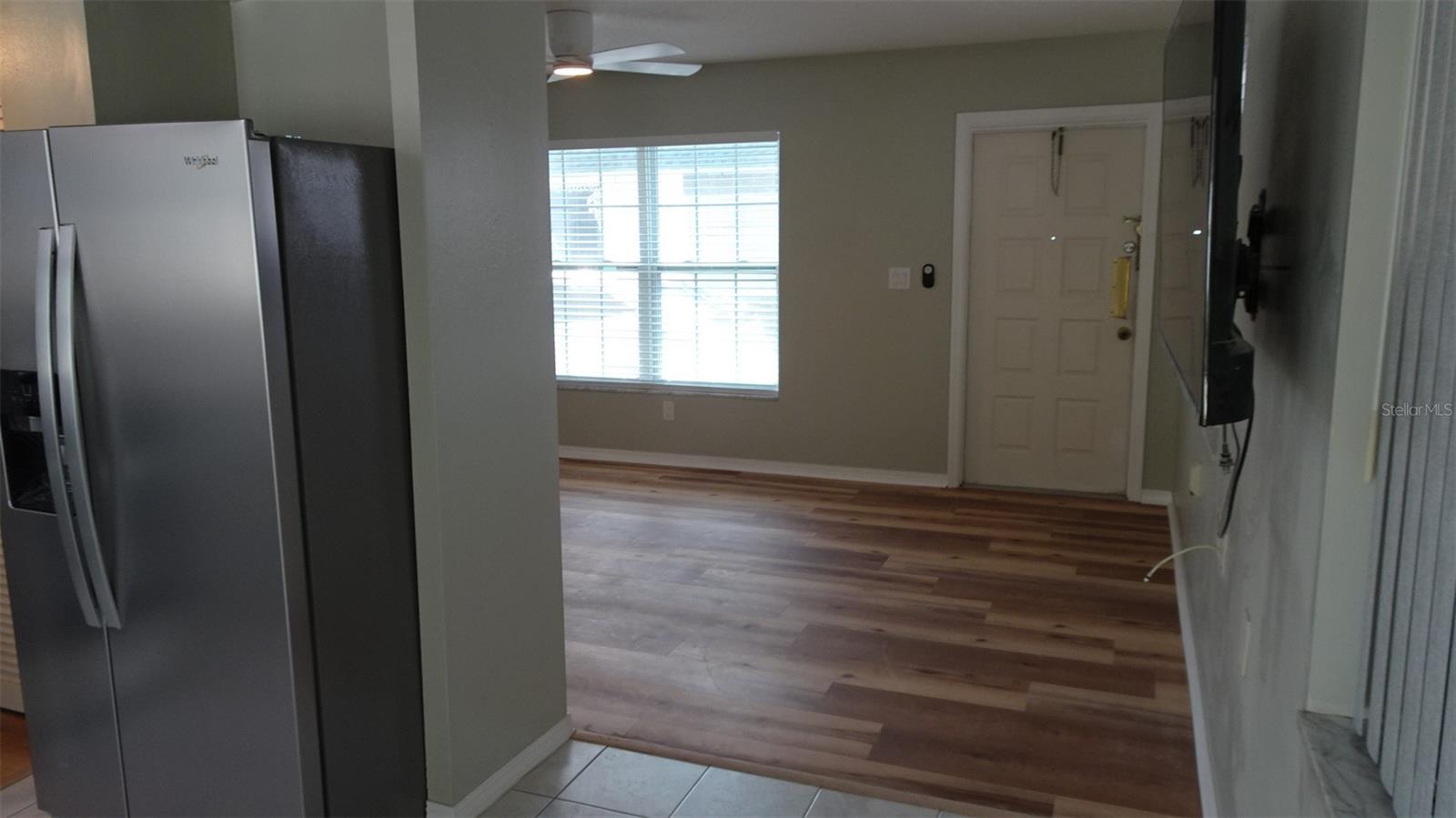 From dining area into living room.. Would you like the wall mounted TV to stay? Just ask.