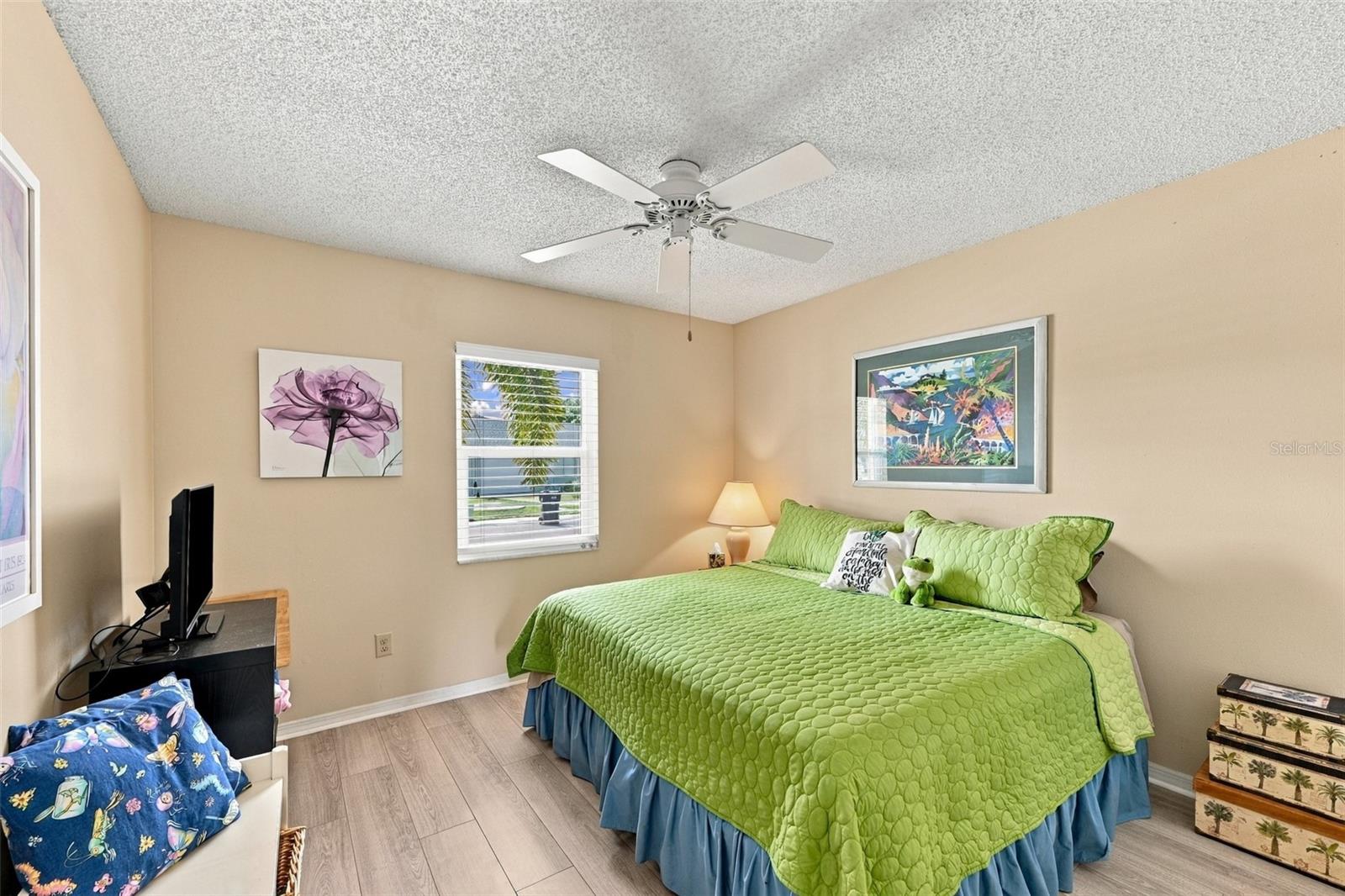 Guest bedroom is bright and comfortable.