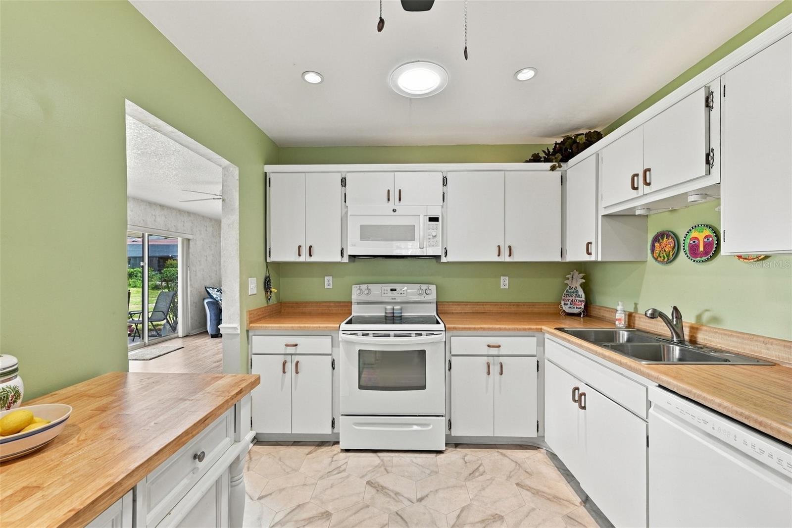 Florida muted tones and crisp bright white accents are placed throughout the kitchen.