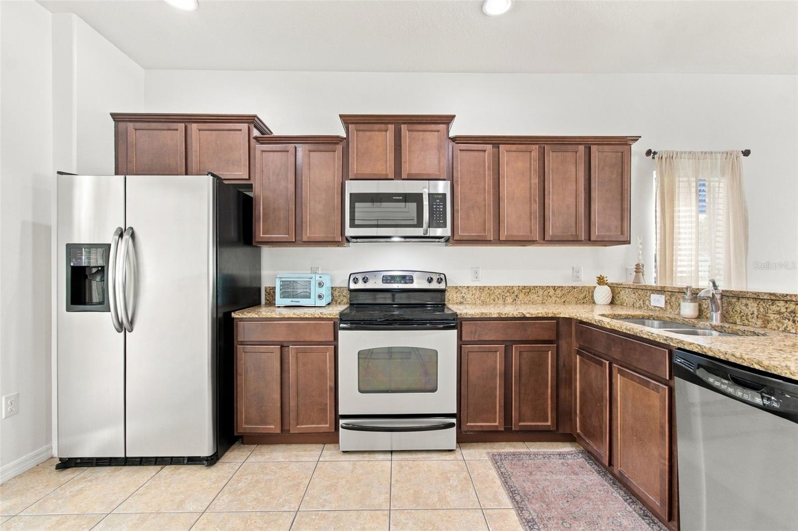 Open kitchen layout with breakfast bar Open kitchen layout with breakfast bar