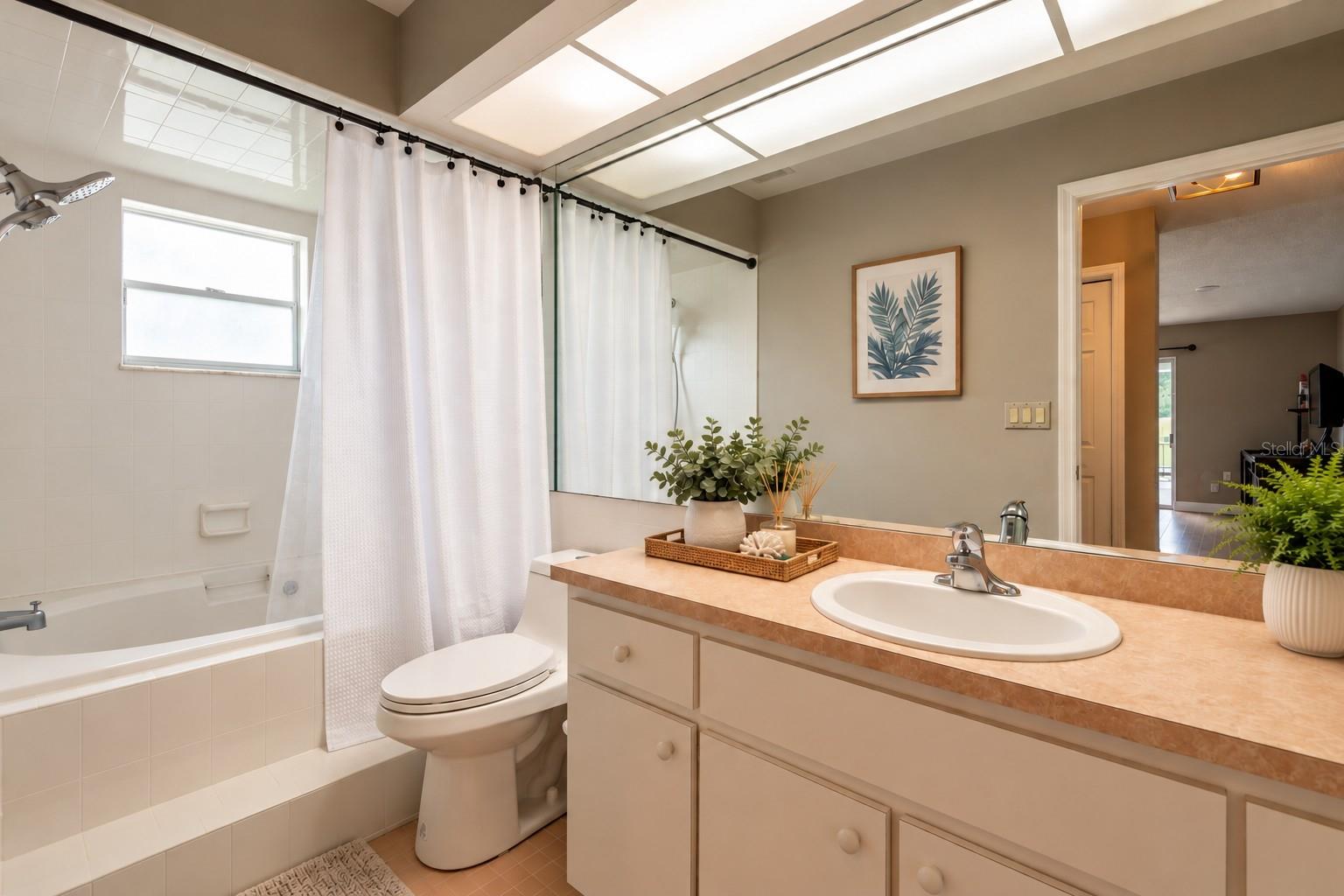 Primary suite with large soaking tub/shower.