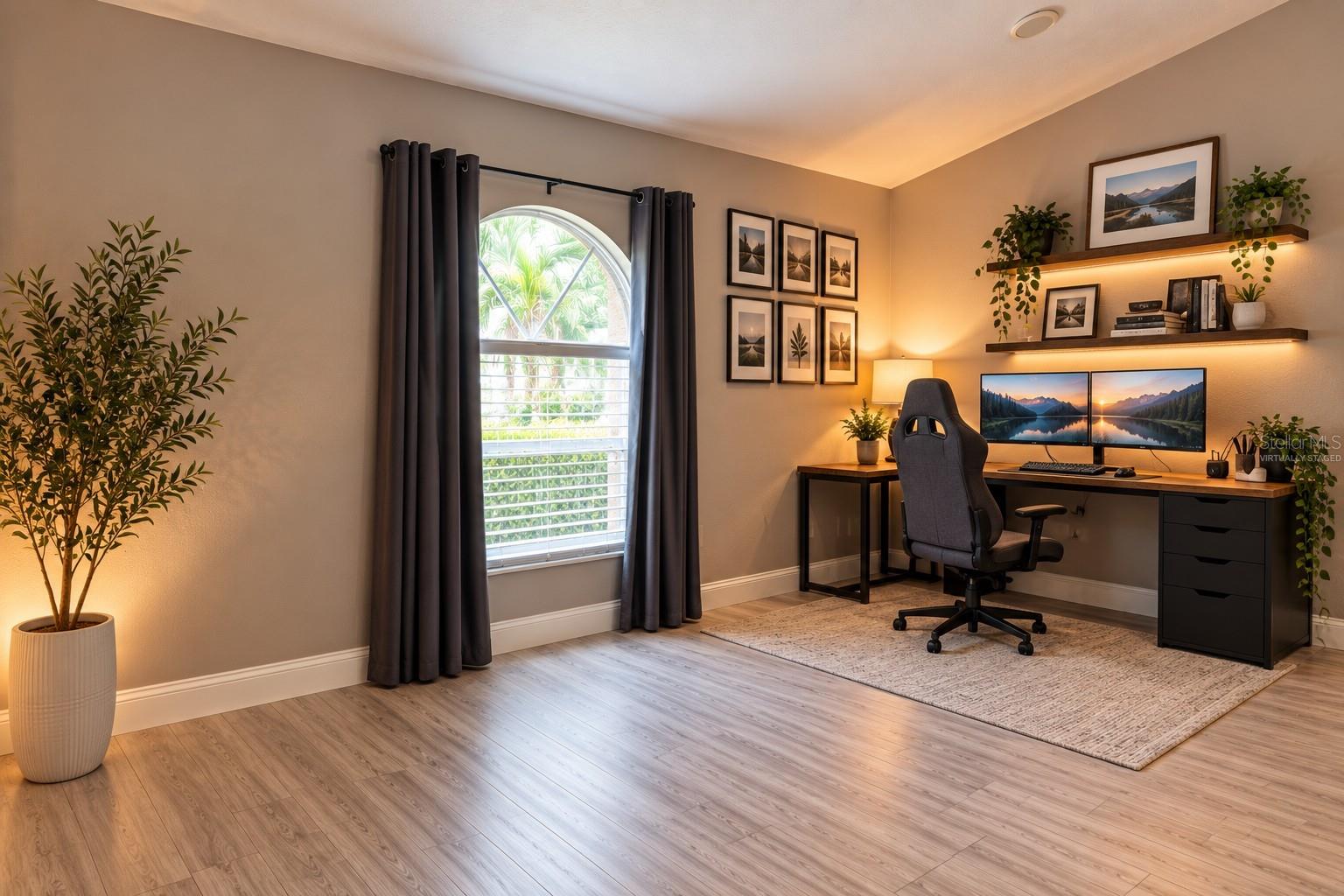 Virtually staged desk area at front of great room.