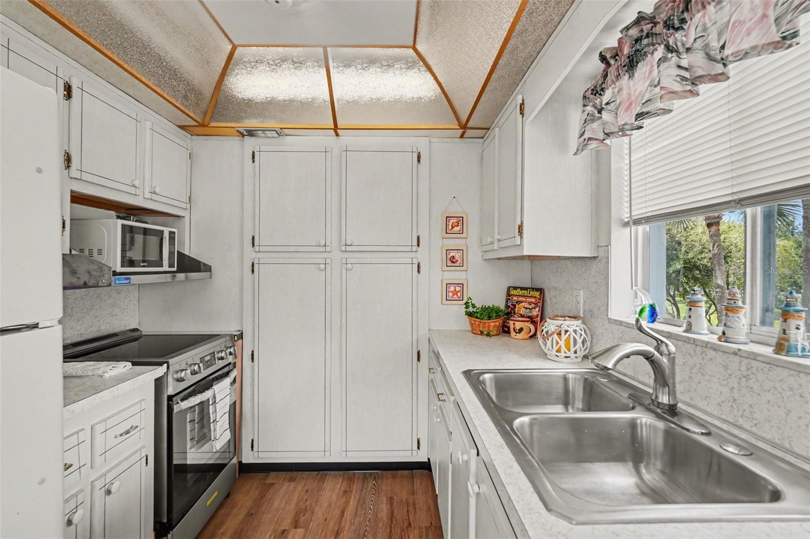Galley style kitchen has lots of storage!