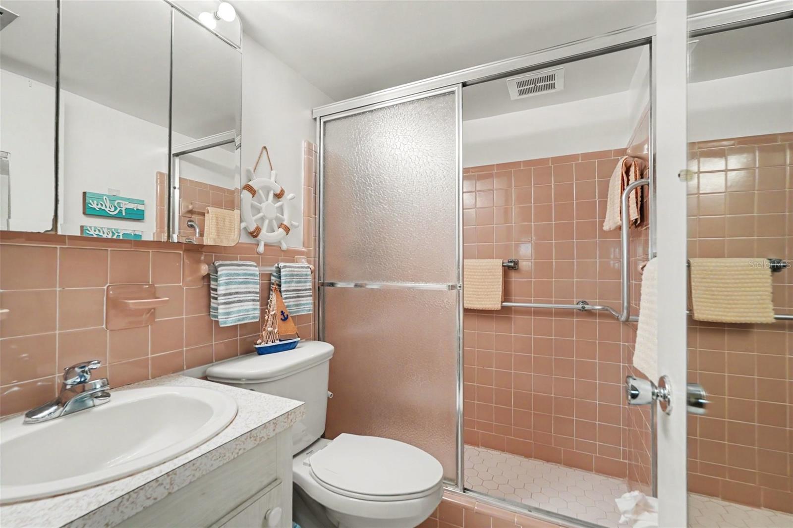 Private en-suite primary bathroom with full size shower