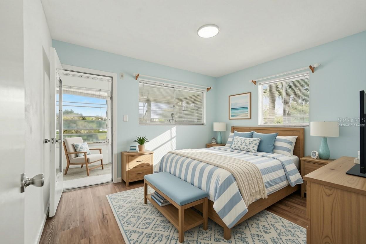 Second bedroom has access to the rear sunroom! Virtually staged
