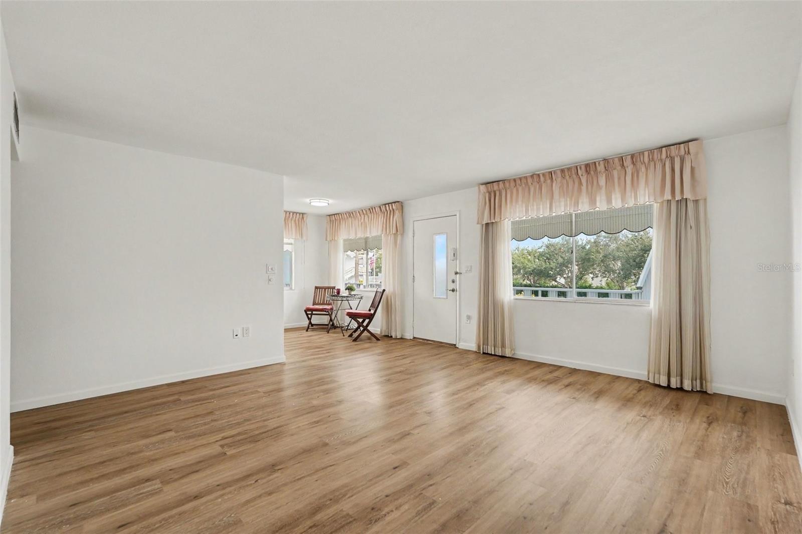 New flooring greets you in this large sun filled corner unit condo!