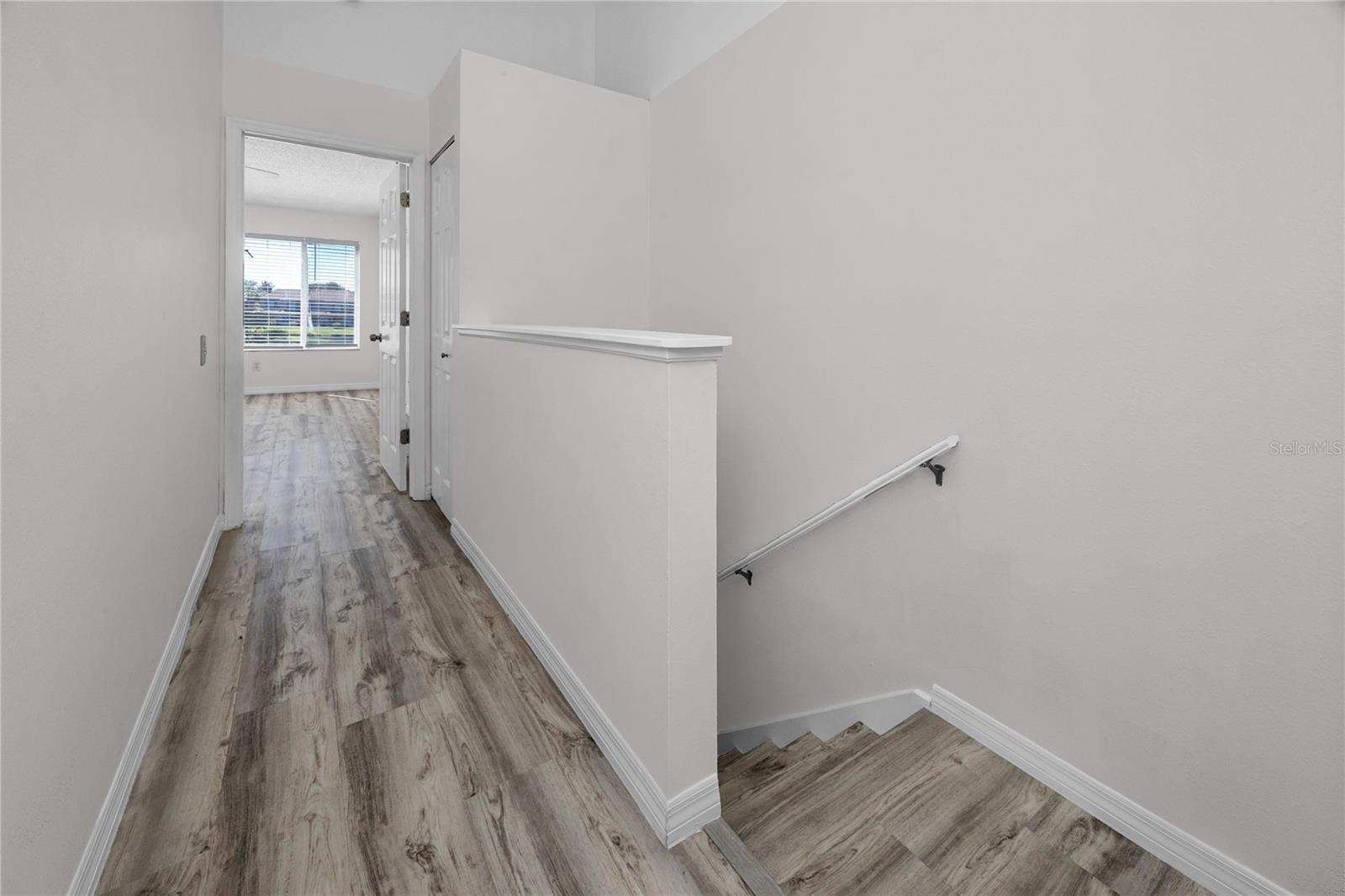 Upstairs Hallway with LVP -6229 Bayside Key Dr, Tampa, FL 33615