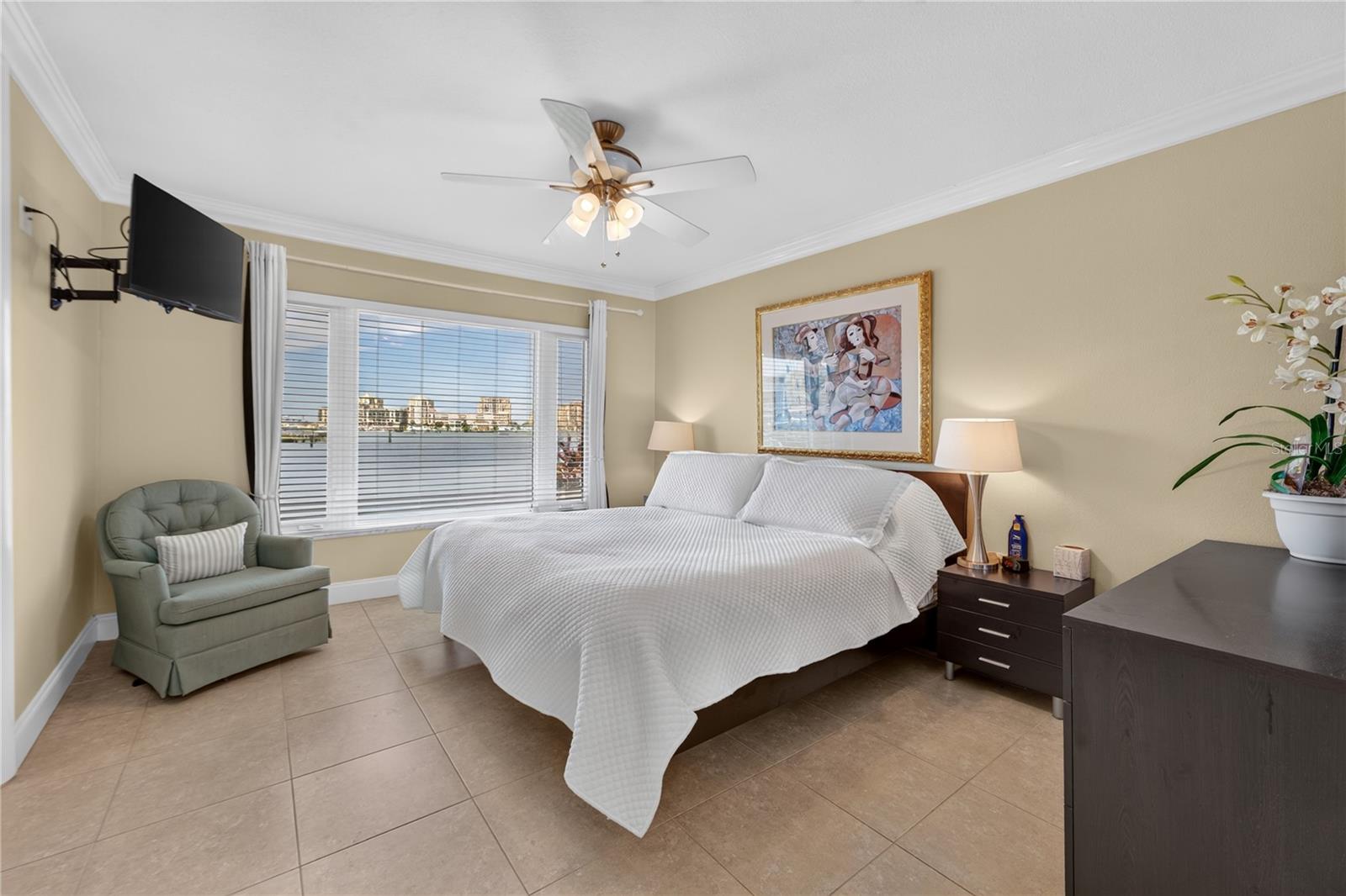 Primary bedroom with large windows to enjoy the water views