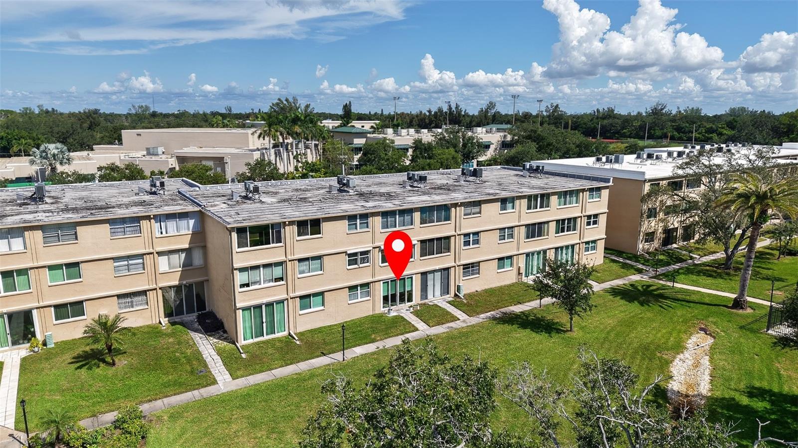 View of condo and courtyard with sidewalks