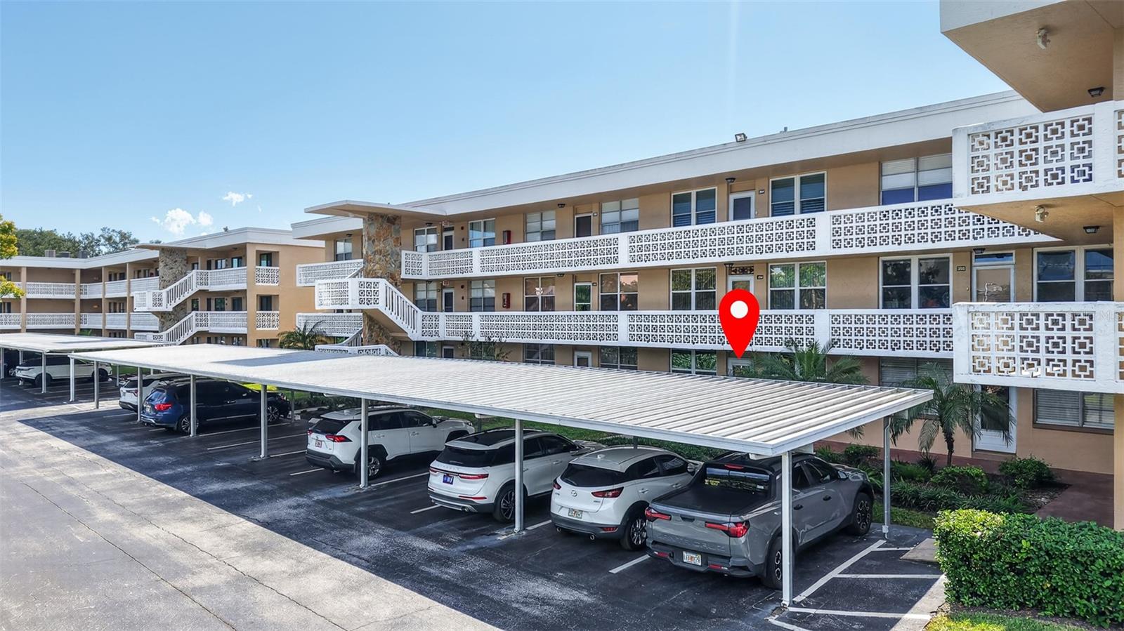 Front of building with covered parking.