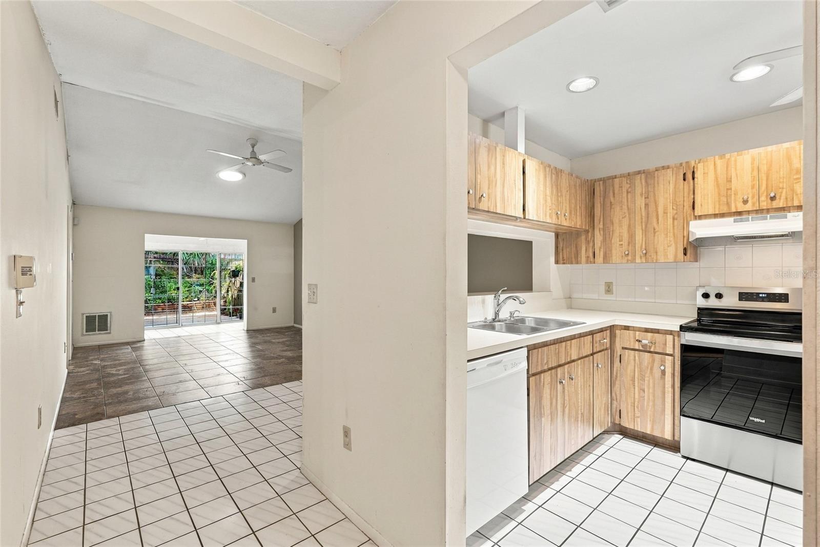 Kitchen with Living room in background