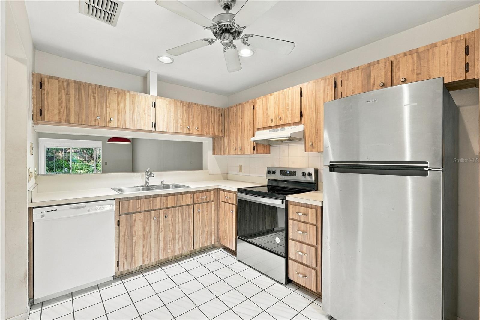 Kitchen with pass through window to Dining Room
