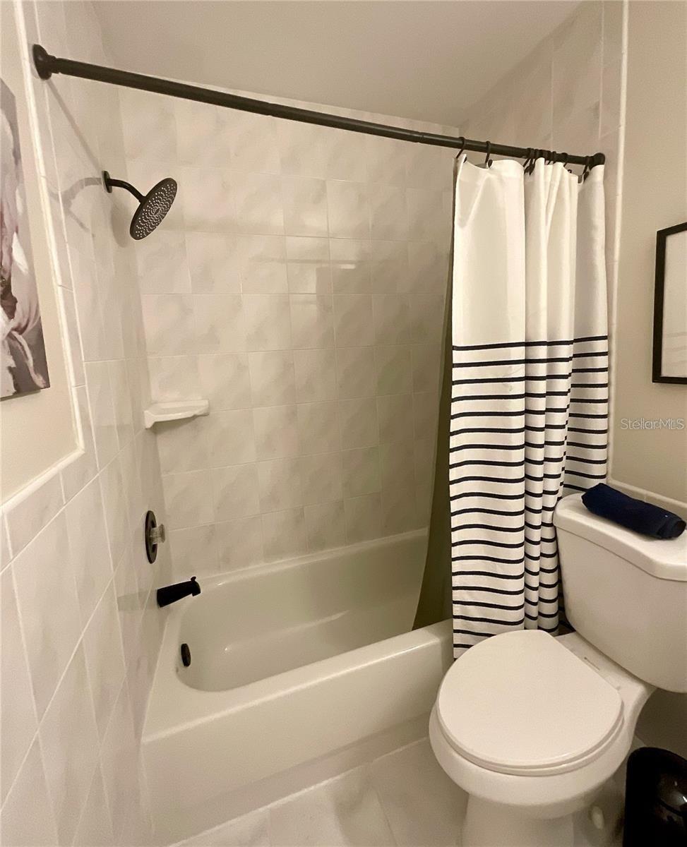 Bathroom tub and shower.