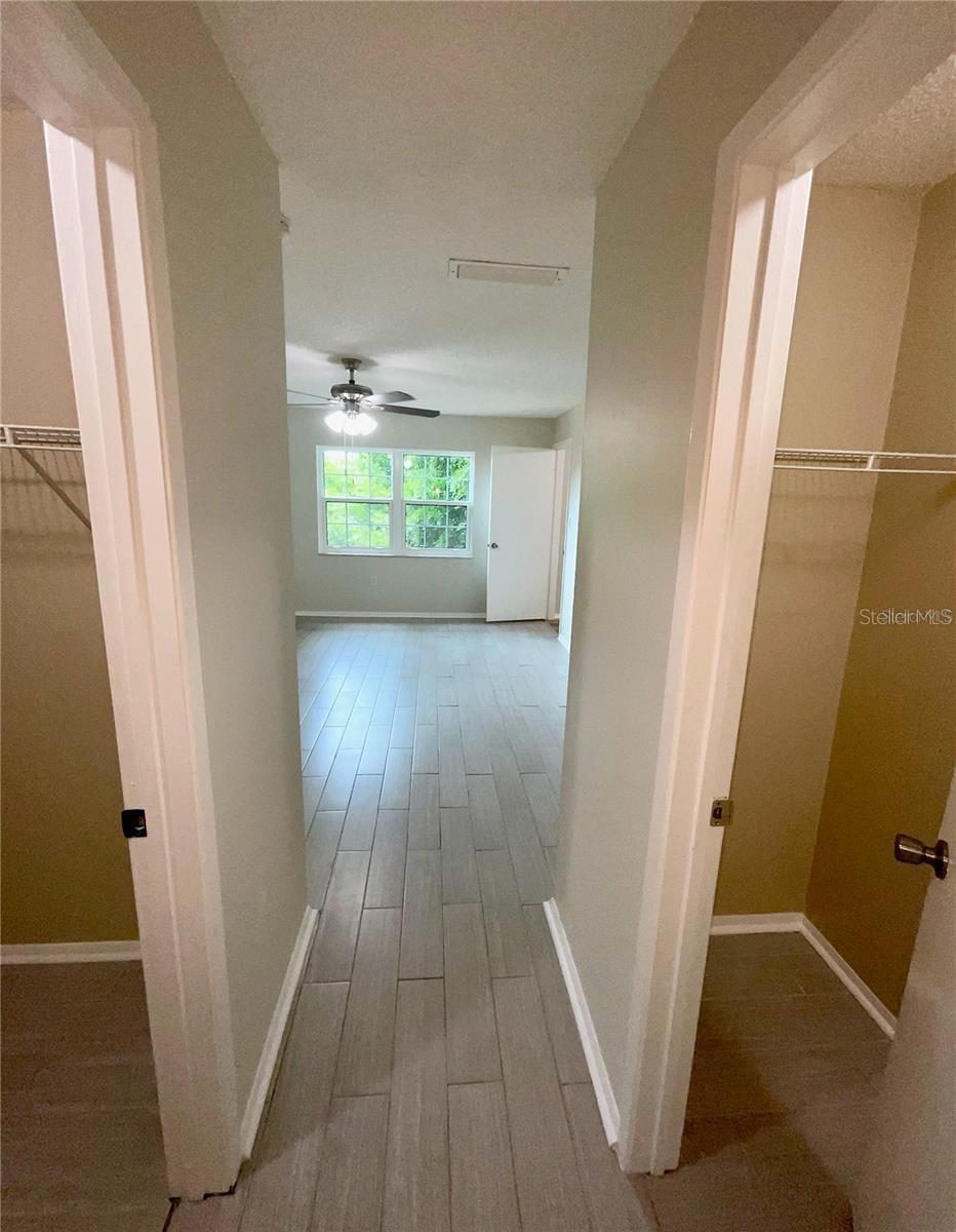 2nd bedroom entry with large walk-in closet on left and another closet on the right.