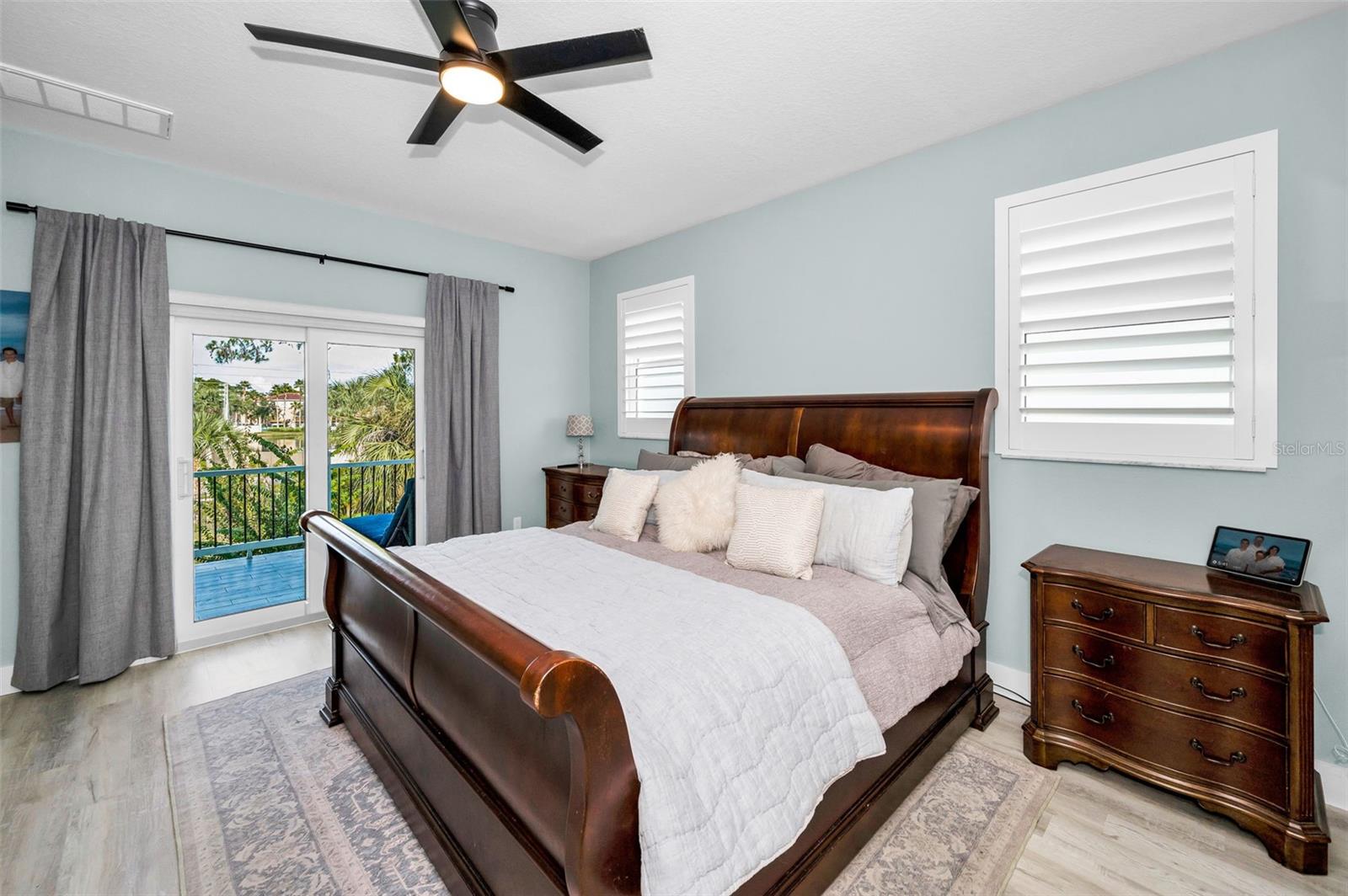 Primary bedroom with balcony