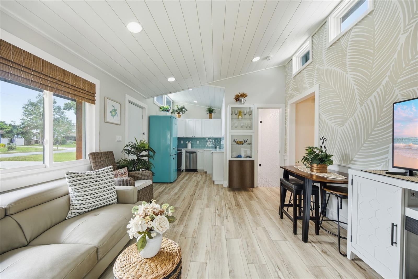 Vaulted shiplap ceilings, abundant natural light