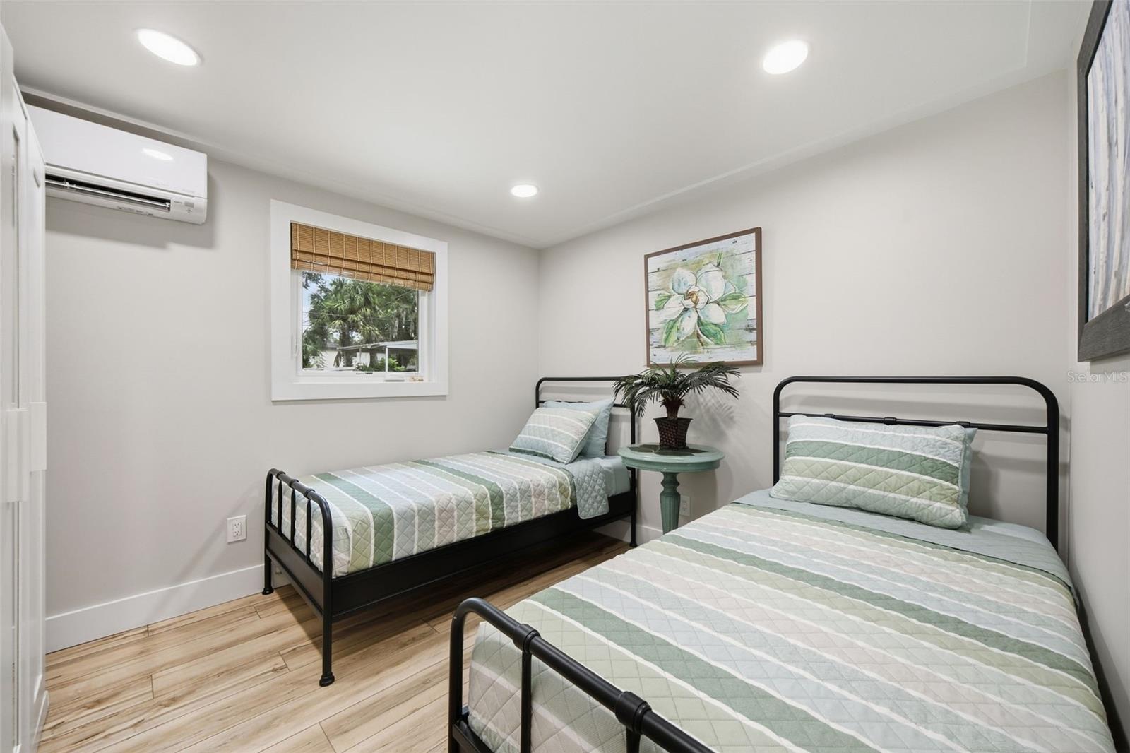 Second bedroom with room for two beds, ample closet space and dedicated climate control.
