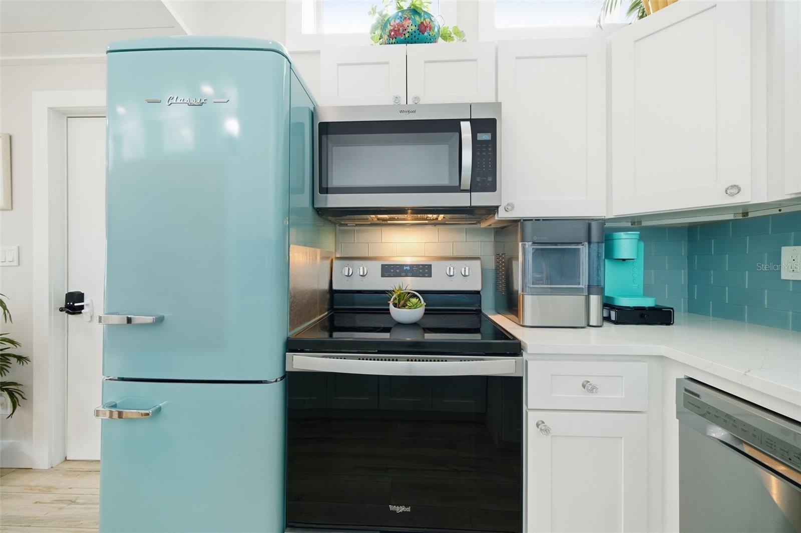 Thoughtfully equipped kitchen w/countertop ice maker and dedicated coffee station