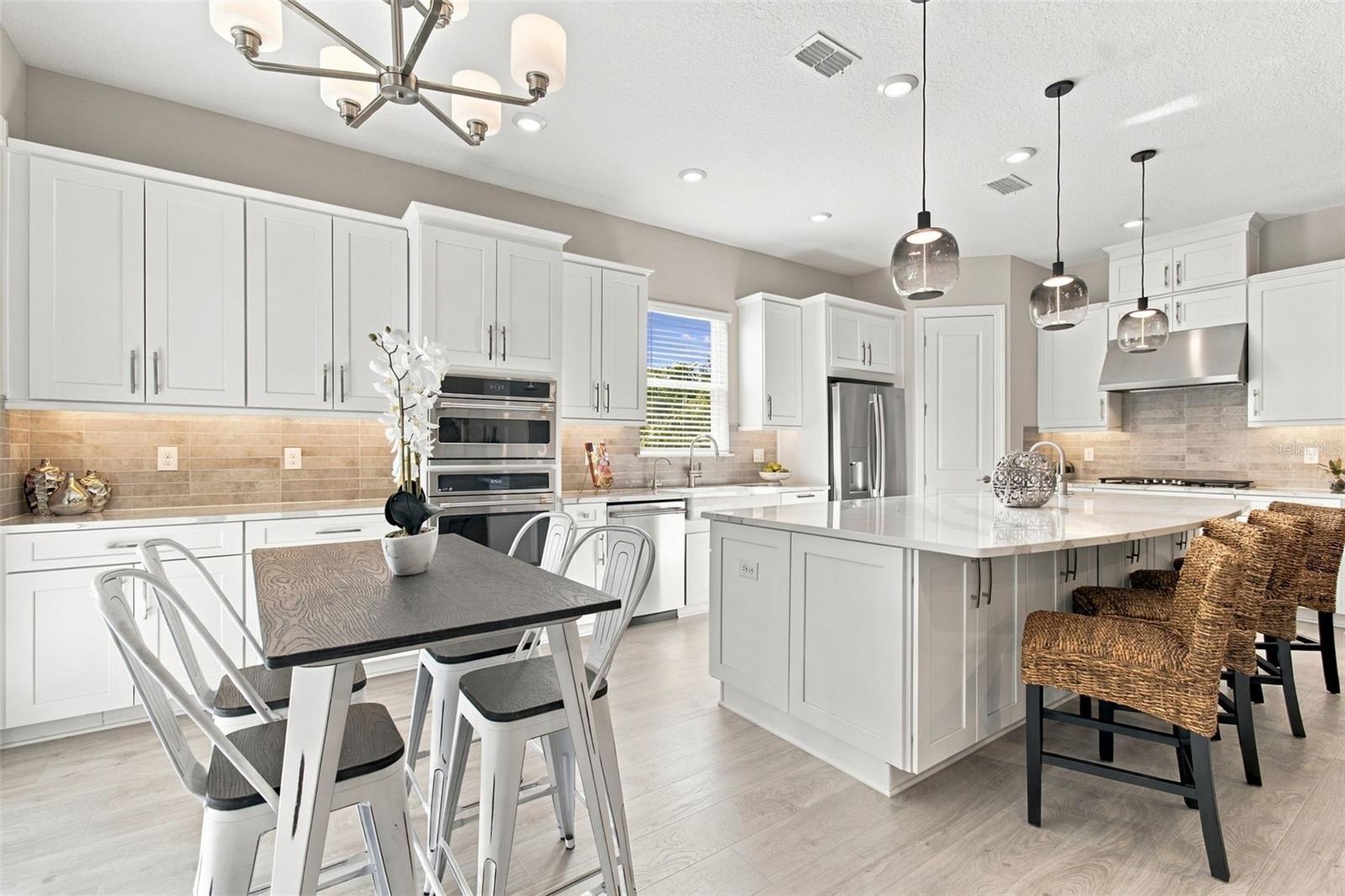 Upgraded kitchen with extended cabinetry provides great storage Upgraded kitchen with extended cabinetry provides great storage