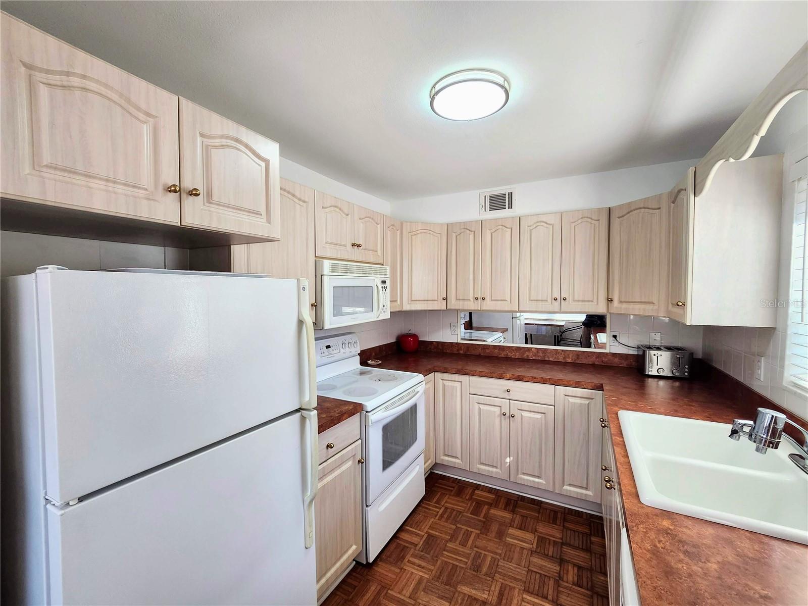 Ample cabinets, light & bright!