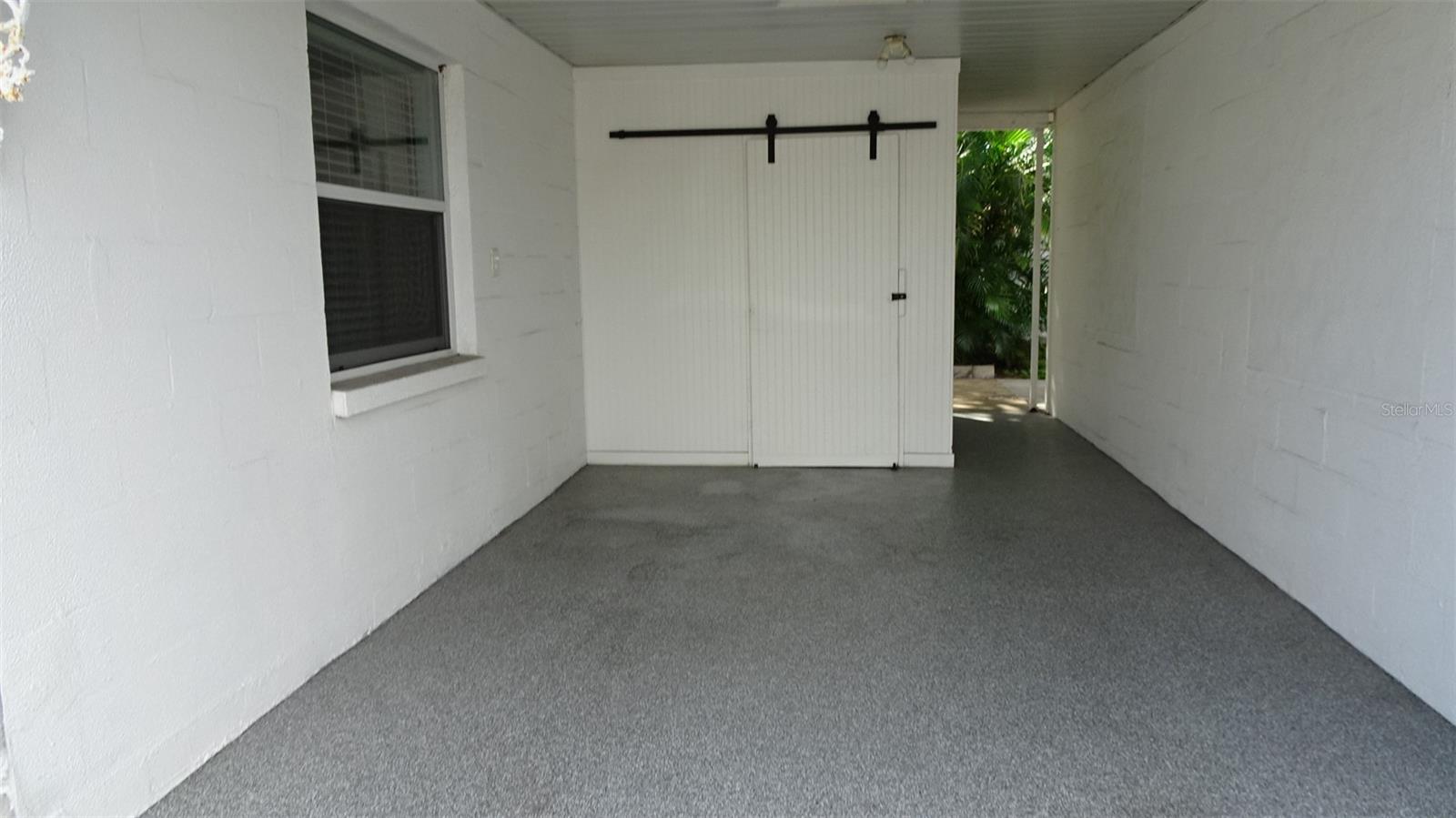 Private carport with storage.